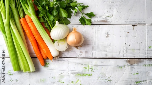 a smoother image that captures a small, thoughtfully selected assortment of vegetables commonly used in chicken soup, excluding broccoli, carrots, onions, celery, and parsley, white wooden background photo