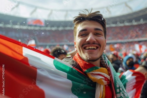 A man is smiling and holding a flag Italy. Football fan at the European Football Championship photo