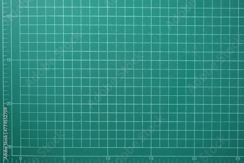 green cutting mat board background with line and scale measure guide pattern for object art design, tool equipment of diy craft work