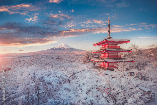 Fujiyoshida, Japan Beautiful view of mountain Fuji and Chureito pagoda at sunrise of Mount Fuji during winter.This is one of the famous spot to take pictures of Mount Fuji. © Travel mania