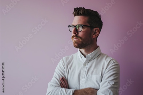 Portrait of a handsome bearded man in a white shirt and glasses © Iigo