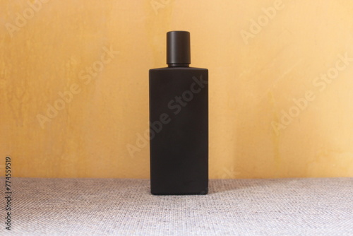 bottle of perfume on a black background