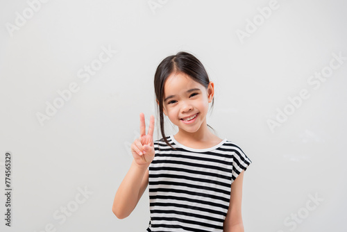 image of Asian child posing Hold up 2 fingers on white background