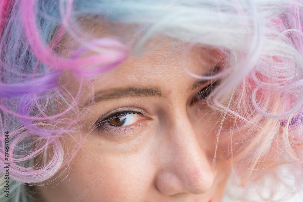 Cropped portrait of curly Caucasian woman with multi-colored hair. Model for hairstyles Cropped portrait of curly Caucasian woman with multi-colored hair. Model for hairstyles