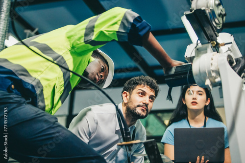 Robotic engineer and team oversee software, machine tool performance, enhance program for efficiency
