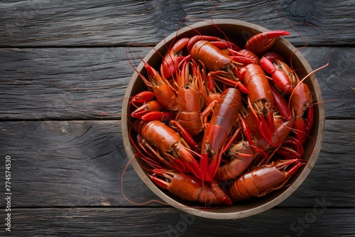 Fresh boiled crawfish on rustic wooden background, culinary delight