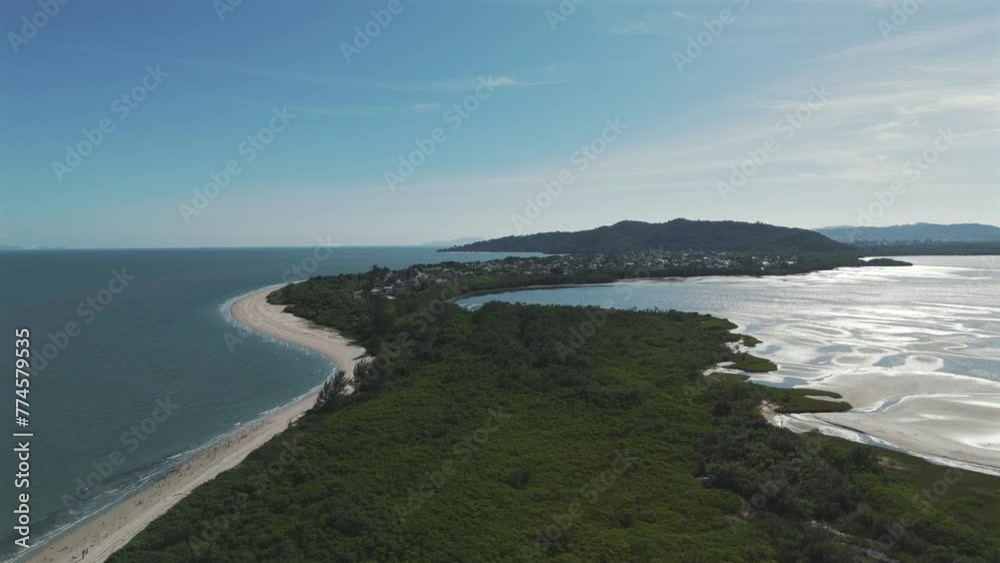 Drone image going up and discovering Daniela beach, in Florianopolis, the island of magic. Drone image going up and discovering Daniela beach, in Florianopolis, the island of magic.
