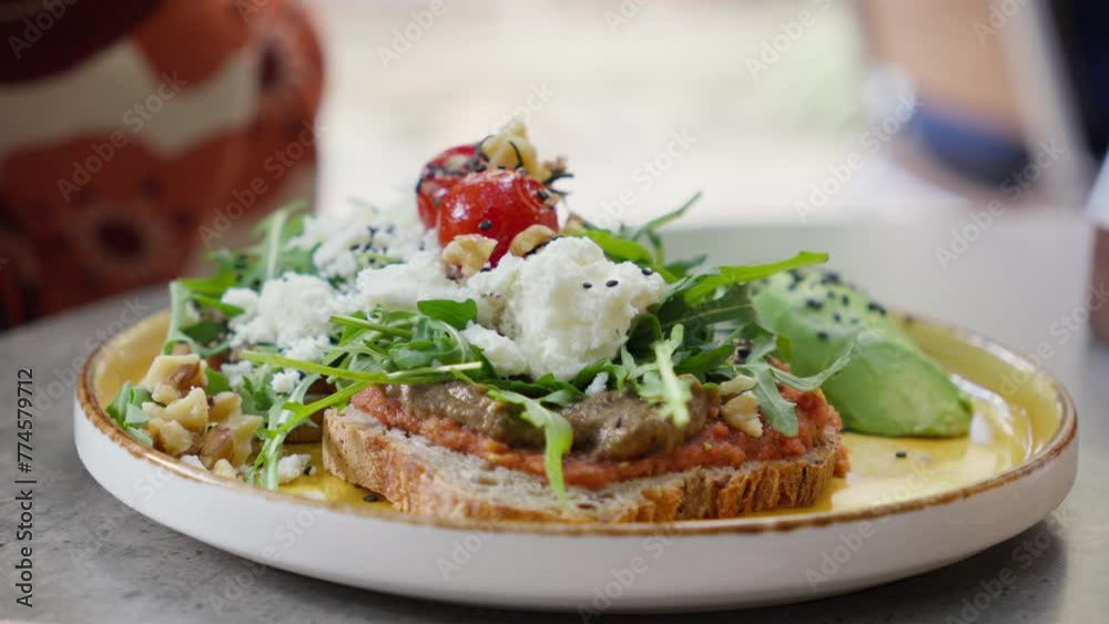 Gourmet toast with fresh arugula and cheese on plate. Gourmet toast with fresh arugula and cheese on plate.