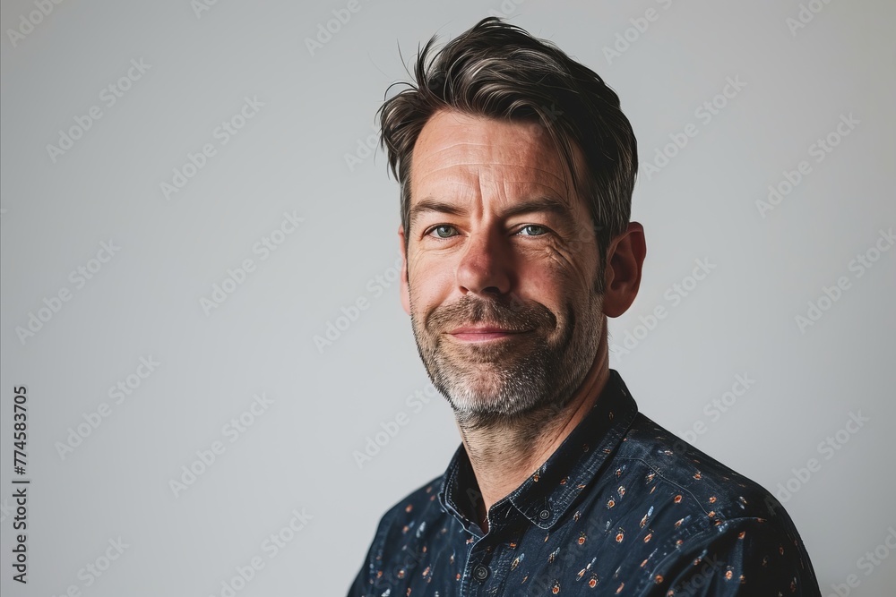 Portrait of a handsome middle-aged man with grey hair and beard Portrait of a handsome middle-aged man with grey hair and beard