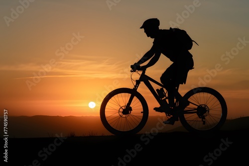 shot Silhouette of a man on mountain bike at sunset photo