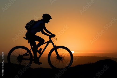 Silhouetted sunrise mountain biker girl, outdoor adventure, cycling hobby