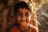 Portrait of a young indian boy smiling at the camera.