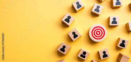 Target customer, buyer persona, marketing segmentation, job recruitment concept. Wooden cubes with target customer icon on yellow background. photo