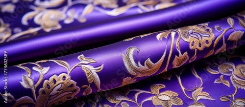 Elegant fabric featuring a stunning gold floral pattern on a rich purple background