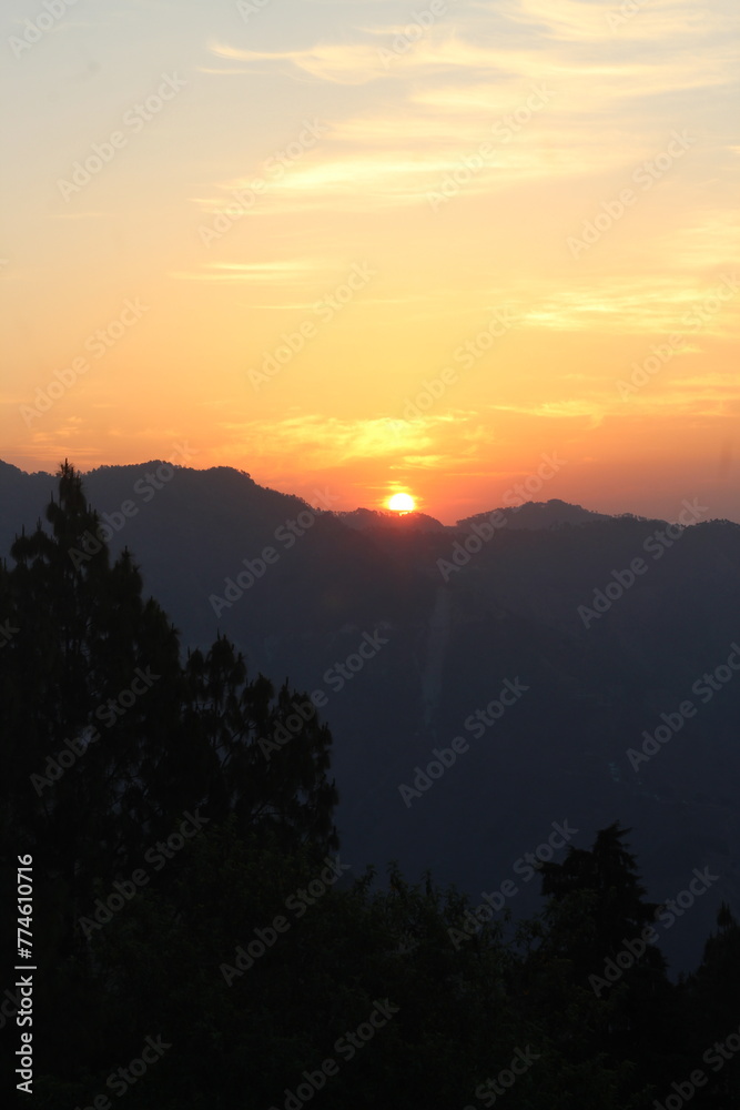 orange sky sunrise at the mountains of uttarakhand india