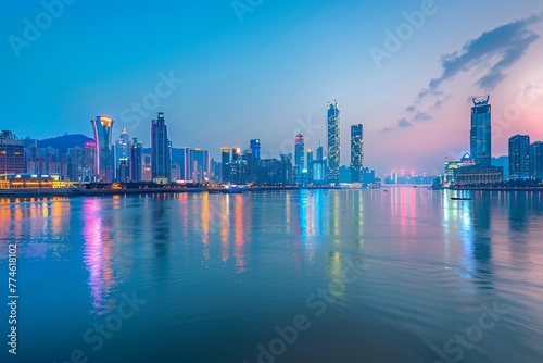 a city skyline with a body of water in the foreground