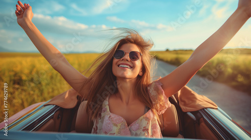Young woman driving in a convertible.