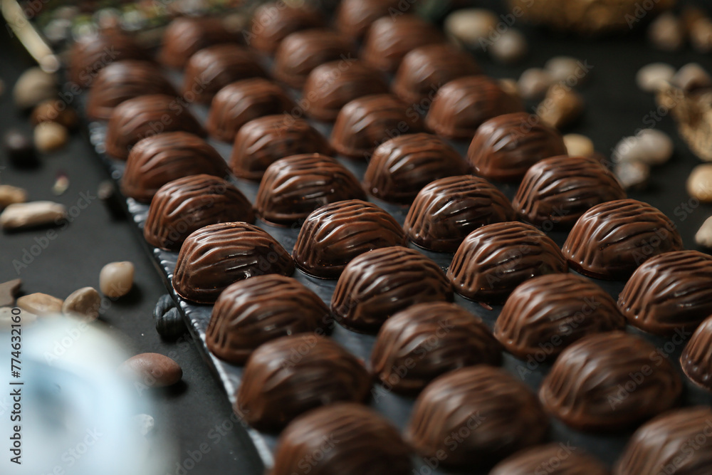 Chocolates Being Aligned on a Conveyor Belt Chocolates Being Aligned on a Conveyor Belt