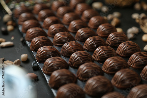 Chocolates Being Aligned on a Conveyor Belt