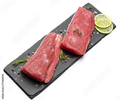 Fresh tuna Fish steak on stone serving board isolated on white background © Anatoly Repin