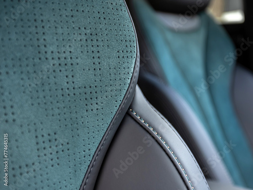 Part of leather car headrest seat details. Сlose-up black  and blue perforated leather car seat. Skin texture © Виталий Сова
