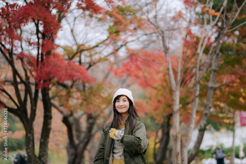 Portrait of a young Asian woman with autumn leaves