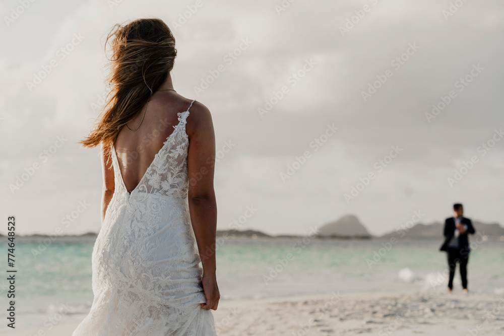married couple in the middle of an island at their wedding session married couple in the middle of an island at their wedding session