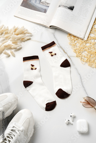 Composition with stylish socks on white background