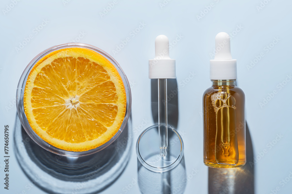 Natural cosmetics laboratory research, bio science, organic skin care, orange fruits and cosmetic oils, beauty from nature. AHA exfoliation testing Natural cosmetics laboratory research, bio science, organic skin care, orange fruits and cosmetic oils, beauty from nature. AHA exfoliation testing