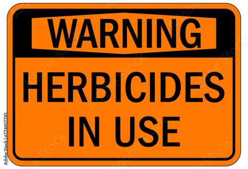 Farm safety sign herbicide in use