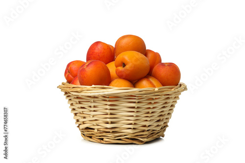 PNG,Fresh apricots in a basket, isolated on white background
