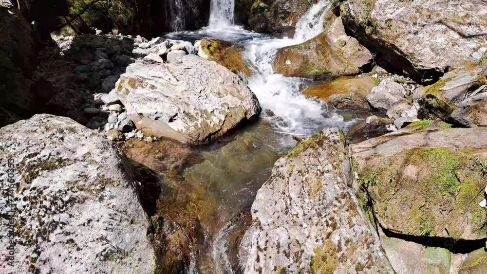 Beautiful waterfall in mountains in summer ,fast sreams Beautiful waterfall in mountains in summer ,fast sreams