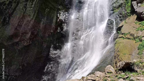 Beautiful waterfall in mountains in summer ,fast sreams  photo