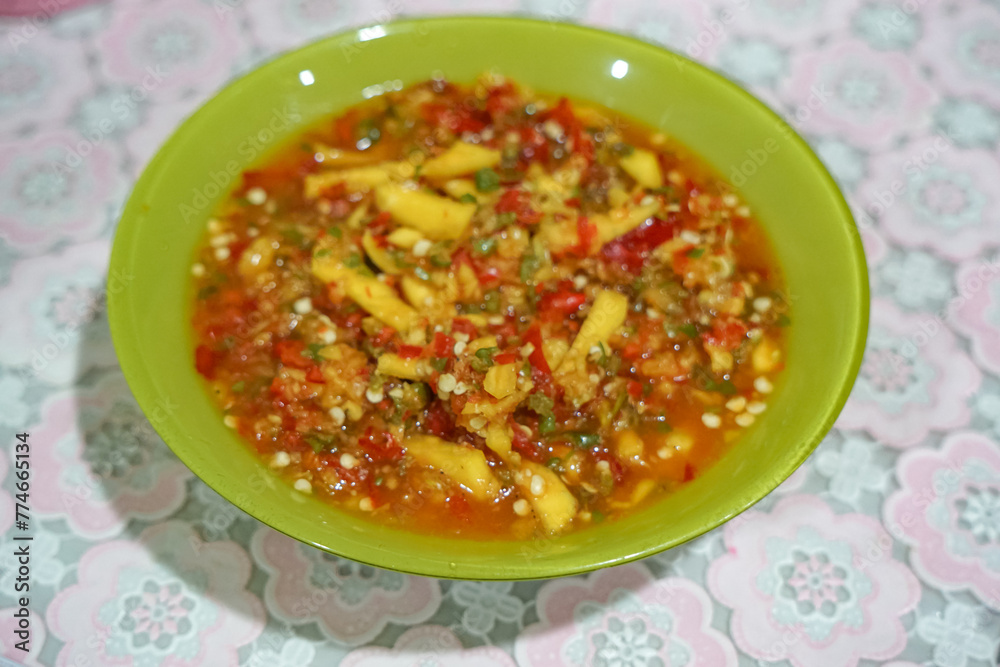Mango Sambal (a Spicy Mango Relish). Usually eaten together with rice during lunch or dinner. Mango Sambal (a Spicy Mango Relish). Usually eaten together with rice during lunch or dinner.