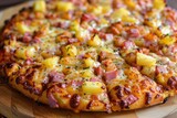 Just baked Hawaiian pizza with pineapple and ham on wooden board