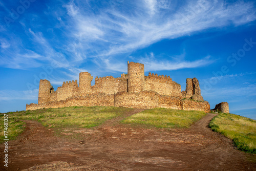 Panoramic view of the medieval walled castle of Almoacid in Toledo, Castilla la Mancha, Spain, with morning light photo