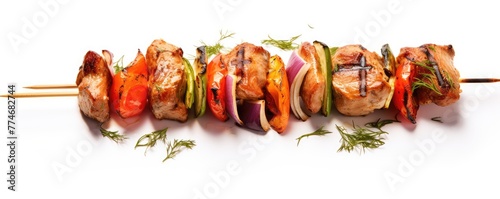 Grilled chicken skewers with vegetables on board © Alena