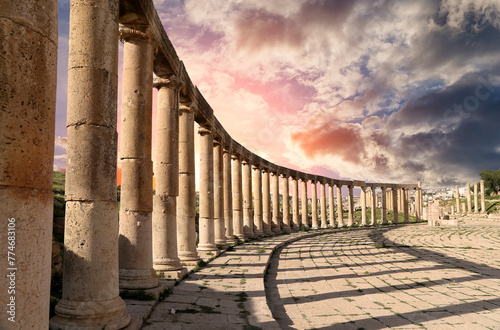 Forum (Oval Plaza) in Gerasa (Jerash), Jordan. Was built in the first century AD. Against the background of a beautiful sky with clouds. #774683106