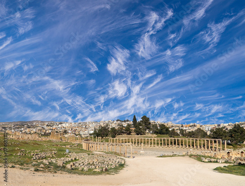 Forum (Oval Plaza) in Gerasa (Jerash), Jordan. Was built in the first century AD. Against the background of a beautiful sky with clouds. #774683112
