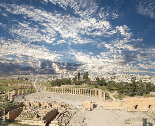 Forum (Oval Plaza) in Gerasa (Jerash), Jordan. Was built in the first century AD. Against the background of a beautiful sky with clouds. #774683312