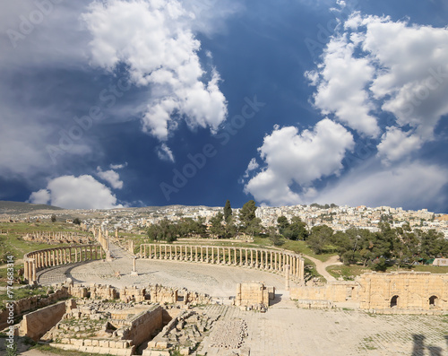 Forum (Oval Plaza) in Gerasa (Jerash), Jordan. Was built in the first century AD. Against the background of a beautiful sky with clouds. #774683314