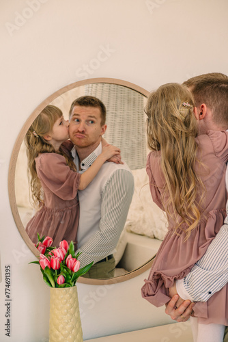 happy father with daughter reflection in the mirror © phpetrunina14