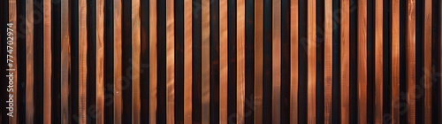 Panel kuchenny z motywem Warm-Toned Vertical Wooden Slats. Close-up of vertical wooden slats in warm brown tones creating a rhythmic pattern.