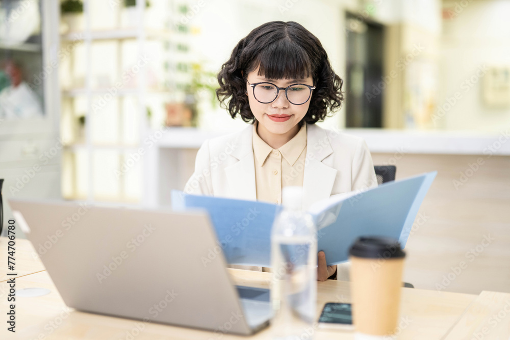 White-collar worker reading documents in office White-collar worker reading documents in office