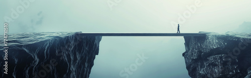 A lone figure is silhouetted against the abyss, poised on a narrow bridge that stretches across a deep chasm enveloped in swirling mist, evoking a mood of contemplation