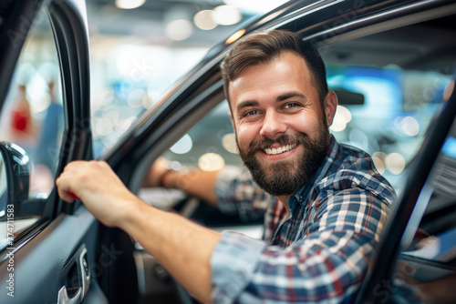 A man with a beard. The car is parked in a showroom. happy fun man customer male buyer client wearing shirt open door get into black car choose auto in showroom. Sales concept photography © Nataliia_Trushchenko