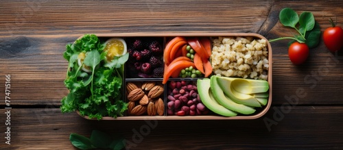 Wooden tray displaying a variety of fresh vegetables, assorted nuts, ripe avocado, and other foods
