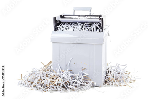Pile of Shredded Paper Next to Paper Shredder