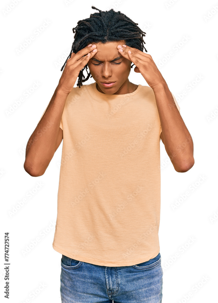 Young african american man wearing casual clothes with hand on head for pain in head because stress. suffering migraine. Young african american man wearing casual clothes with hand on head for pain in head because stress. suffering migraine.