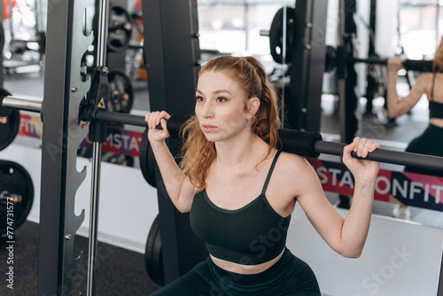 woman trains in fitness gym